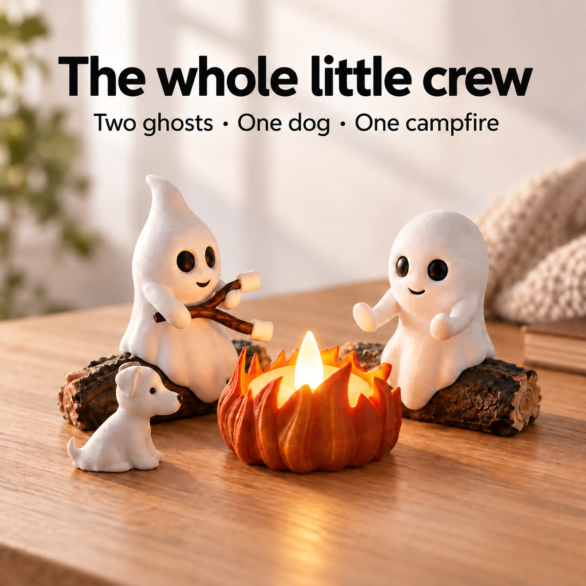 Two ghost figurines, one dog and a glowing campfire displayed together