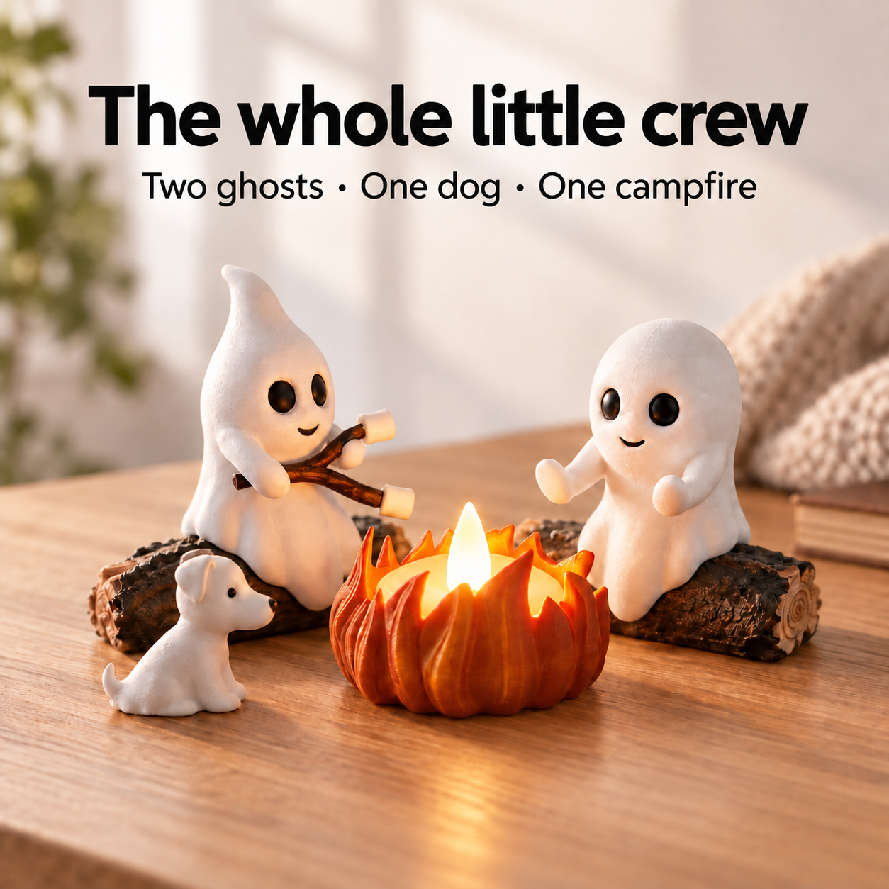 Two ghost figurines, one dog and a glowing campfire displayed together